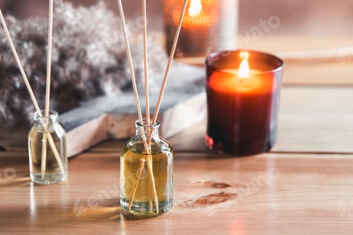 Preview: Reed air freshener with candle and eucalyptus branches on tray indoors, closeup