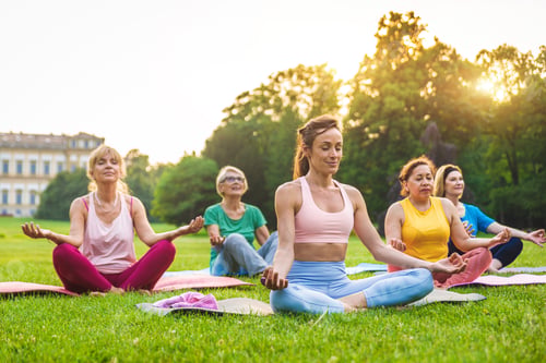 Preview: Senior women training with fitness coach at park