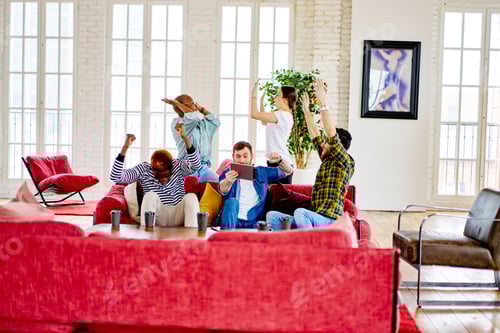 Preview: Group of excited male and female people satisfied in living room