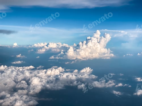 Preview: The airplane flew over the clouds.