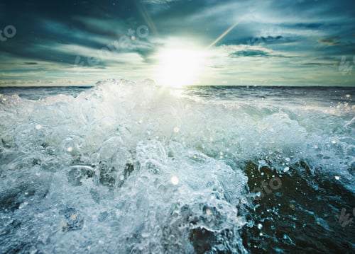 Preview: Sun shining over rocky waves