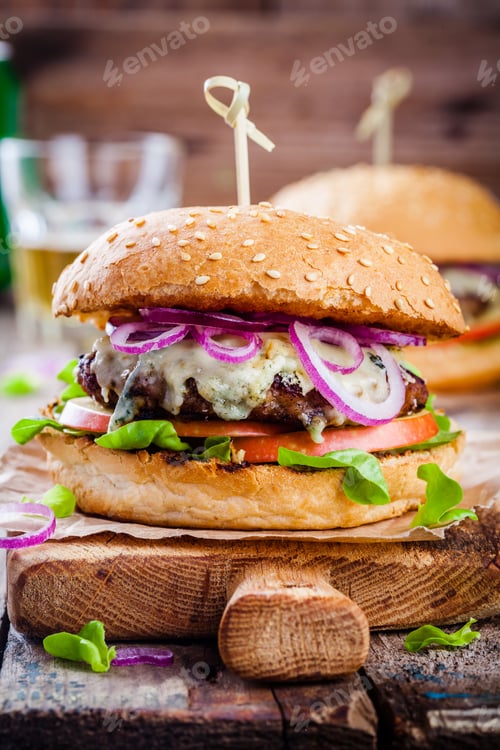 Preview: homemade burger with beef cutlet, apple, lettuce, onion and blue cheese