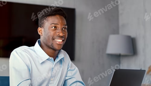 Preview: Smiling Young Man Working From Home