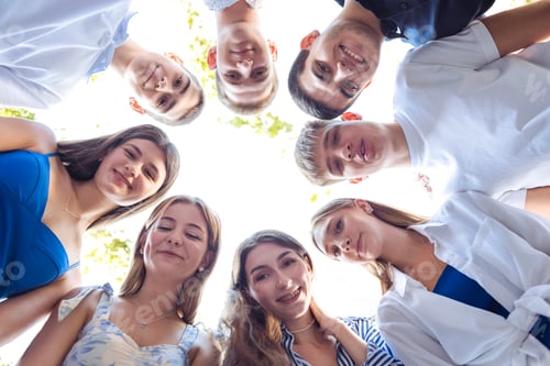 Preview: A group of young people in casual clothes are smiling and posing