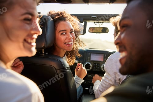 Preview: Four young adult friends in a car on a road trip together