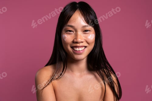 Preview: Beautiful asian woman portrait, asian woman smiling with facial cream on skin