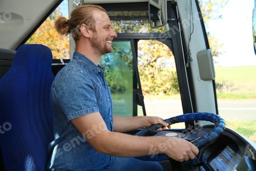 Preview: Professional bus driver at steering wheel. Passenger transportation