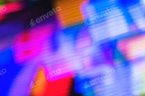 Preview: Defocused colorful neon lights from an amusement park background