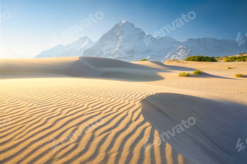 Preview: Nature. Sand dunes in the evening and mountains among the clouds.