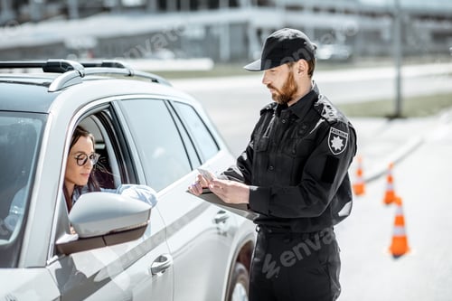 Preview: Policeman with woman driver on the road
