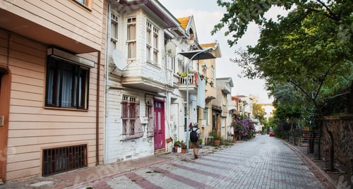 Preview: A tourist with walks and looks at the streetscape in the old town. Princes' Islands, Turkey