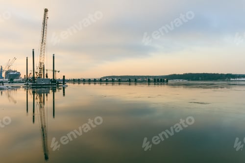 Preview: Beautiful view of a cloudy blue sky reflecting on water in Port of Klaipeda, Lithuania with ships