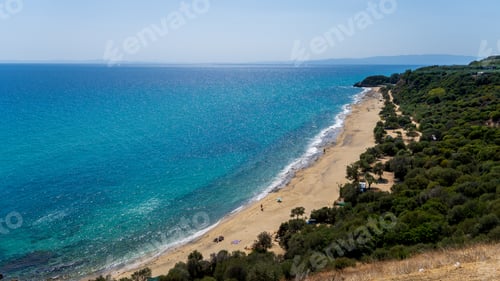 Preview: Scenic view of a green beach against the sea in Greece