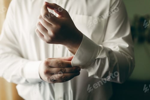 Preview: Man Getting Ready Wearing a White Dress Shirt