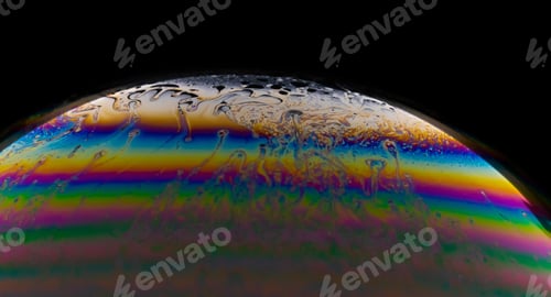Preview: Macro shot of a colorful soap bubble on a dark background