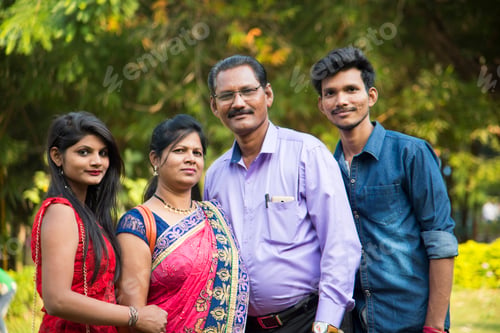 Preview: Happy Indian family at outdoors, Enjoying holiday in park.