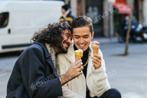 Preview: Happy gay couple enjoying ice cream together in the city