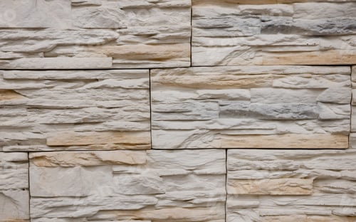 Preview: Textured stone wall featuring a natural, rustic design with warm tones