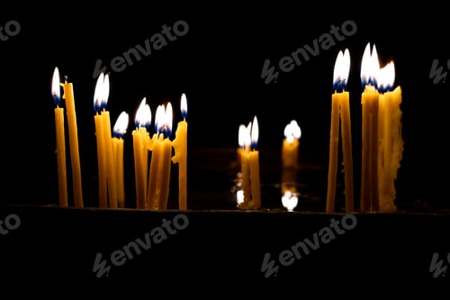 Preview: Lit church candles in the temple.