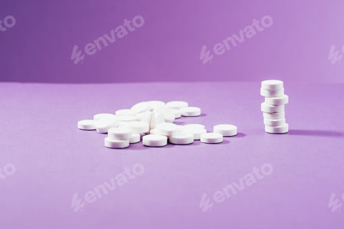 Preview: close up view of arranged pills on purple background