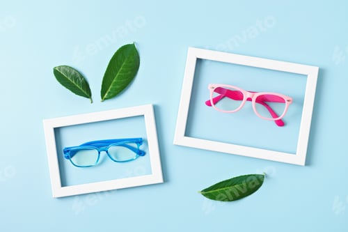 Preview: Child eyeglasses over pastel background. Optical store, glasses selection for kids