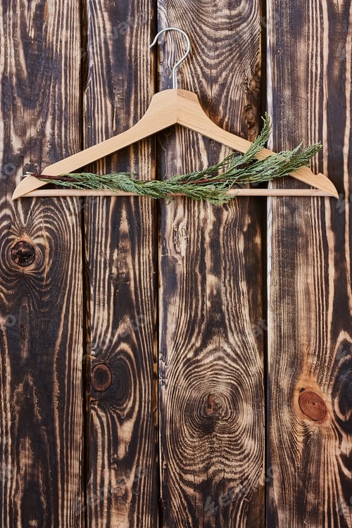 Preview: Wooden Hanger with Greenery on Rustic Wood Background