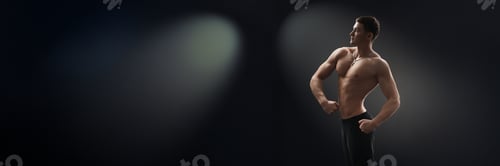 Preview: Confident Pose of Muscular Man Wide Banner with Copy Space