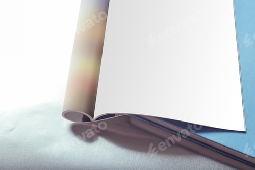 Preview: Open Magazine With Blank Page on Desk