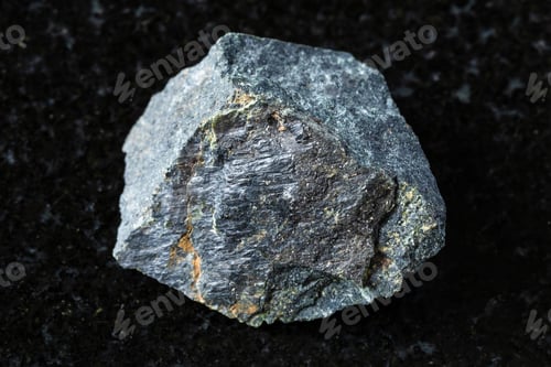 Preview: sample of raw peridotitic komatiite rock on black