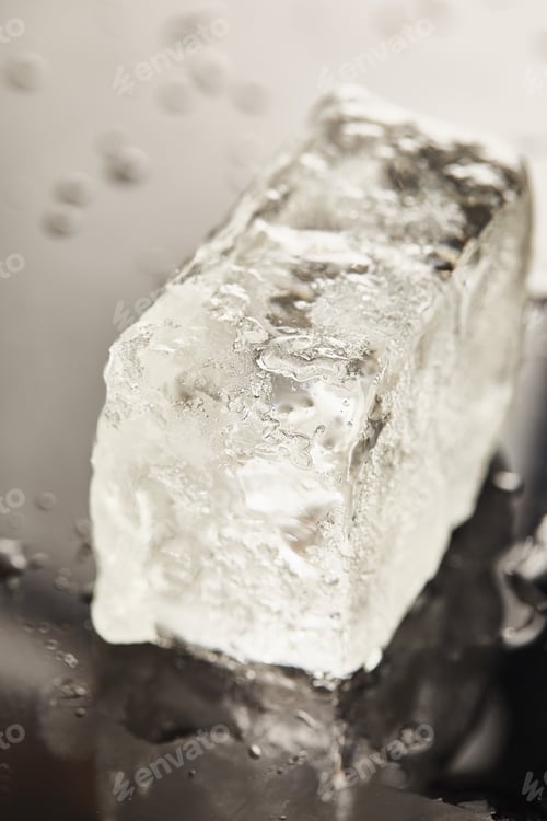 Preview: close up view of transparent wet textured ice cube on black background