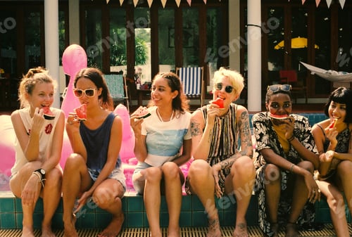 Preview: Group of girls friends eating watermelon at the pool