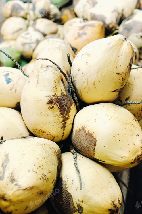 Preview: Yellow coconuts are sold in the market of the island of Mauritius. Sale of vegetarian fruits in the