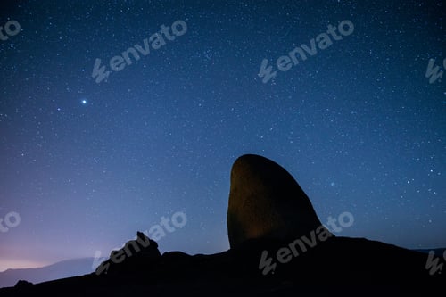 Preview: The starry sky above the mountains peaks