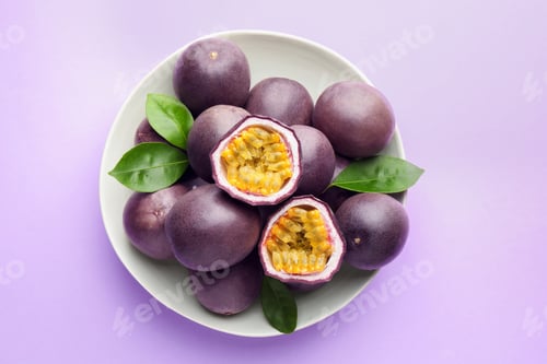 Preview: Fresh passion fruits with green leaves on violet background, top view
