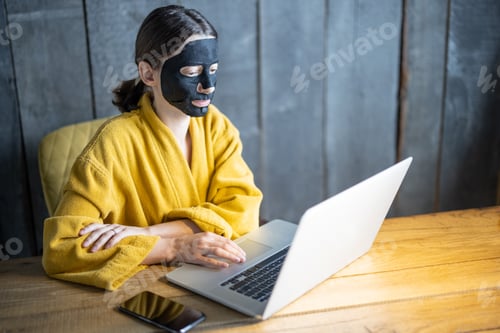 Preview: Woman works on a laptop at home office