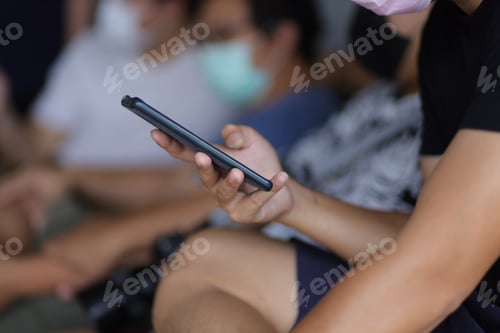 Preview: Group of friends using a smartphone. Concept of people and use of communication technology.