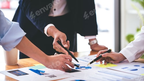 Preview: Team work with business analytic price chart on the table at the conference room.