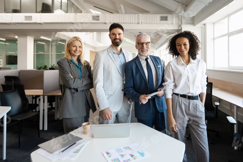 Preview: Business team smiling in modern office discussing strategy for new project