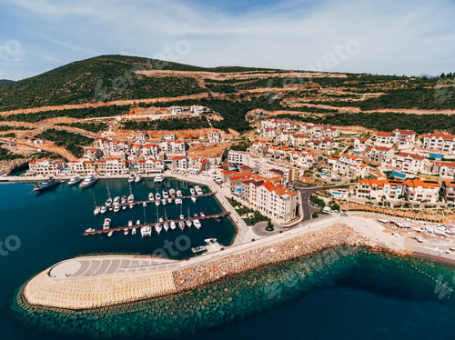 Preview: Aerial view of the breakwaters in front of the luxury residential complex Lustica Bay. Montenegro