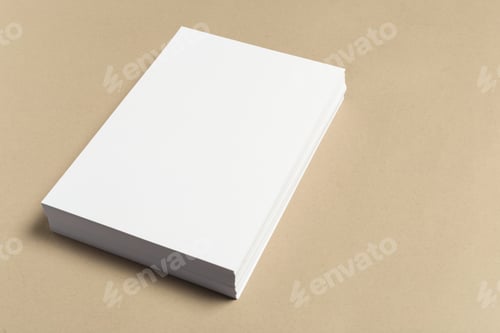 Preview: Blank stack of paper on a light brown surface during daylight hours