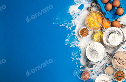 Preview: Baking ingredients on blue color background, top view