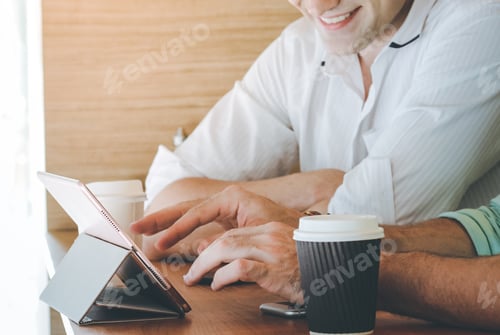 Preview: Two businessmen meeting at the cafe