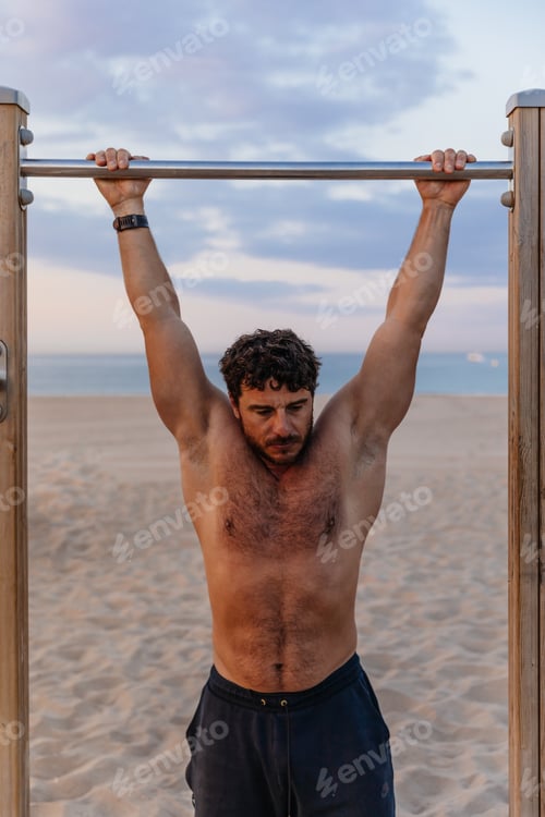 Preview: man pulling up on beach