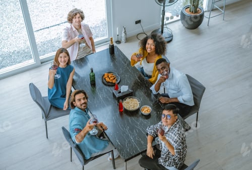 Preview: Lively, diverse friend reunion. Laughter, stories, bonding, music, dance, joyful atmosphere.