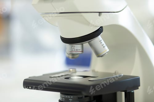 Preview: Closeup of a white microscope in a laboratory setting