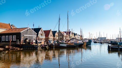 Preview: Urk Flevoland Netherlands sunset at the lighthouse and harbor of Urk Holland