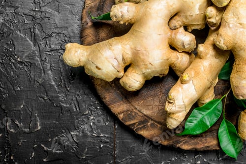 Preview: The sweet of fresh ginger on a wooden cutting Board.