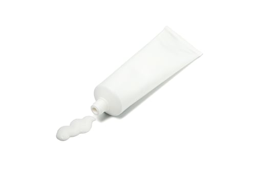 Preview: Blank tube with toothpaste isolated on white background