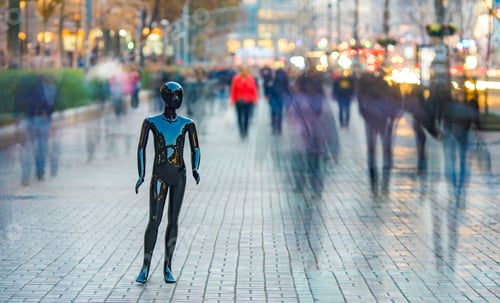 Preview: The black mannequin stands on the street among the stream of people