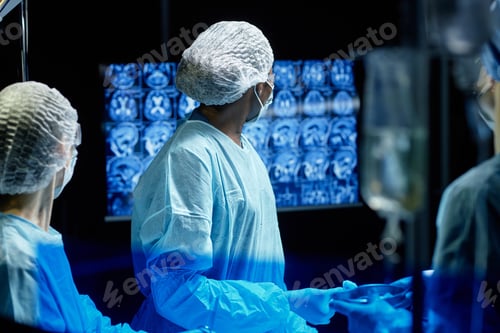 Preview: Woman Surgeon Looking at Monitor